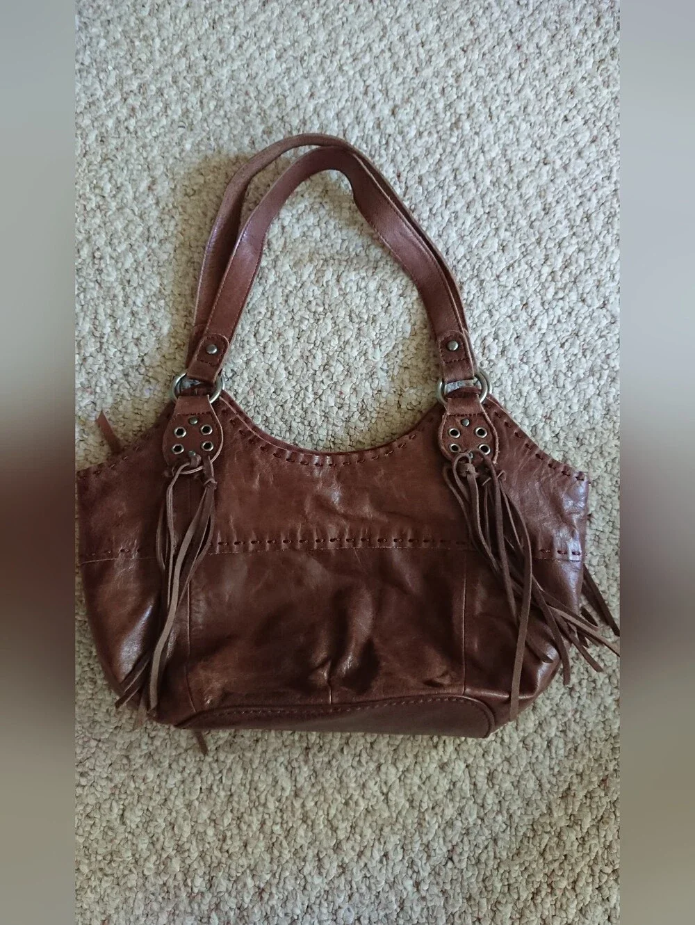 The Sak Indio large brown leather hobo shoulder bag with fringe tassels